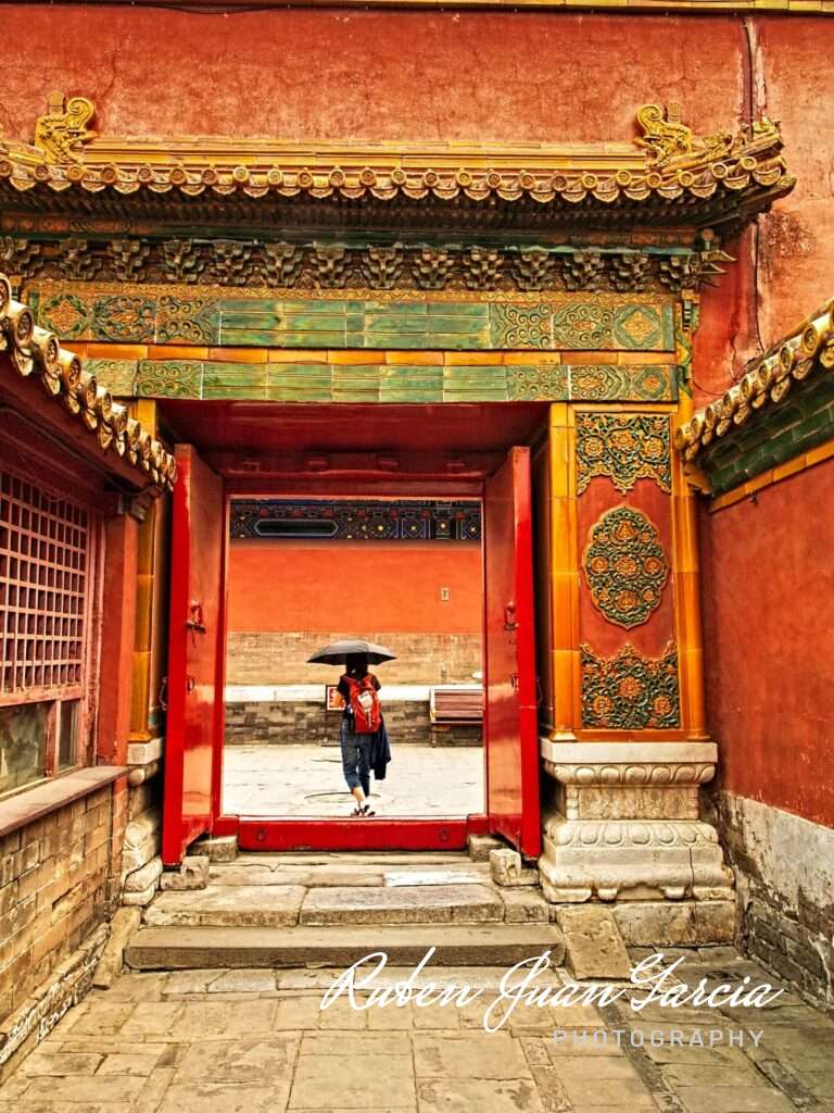 Walking through one of the Forbidden City palace gates.